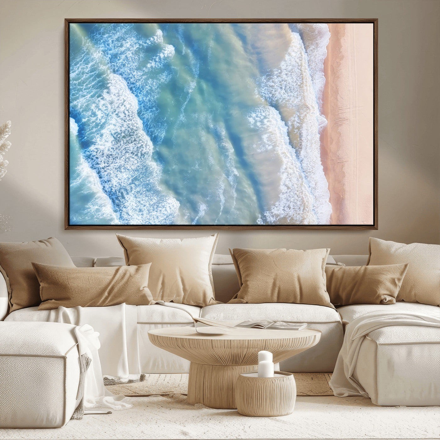 Aerial photo of soft blue waves meeting sandy shore, perfect for modern coastal or beach-themed decor with a light and tranquil aesthetic.