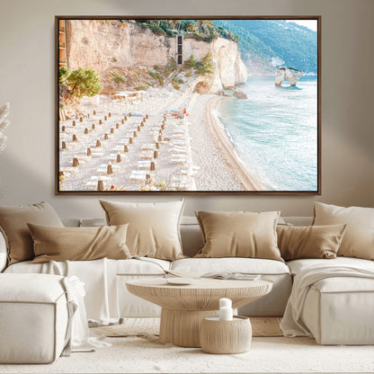 Wall art of a calm Mediterranean beach with rows of sun loungers and umbrellas in soft pastel tones, perfect for light coastal or vacation-themed decor.