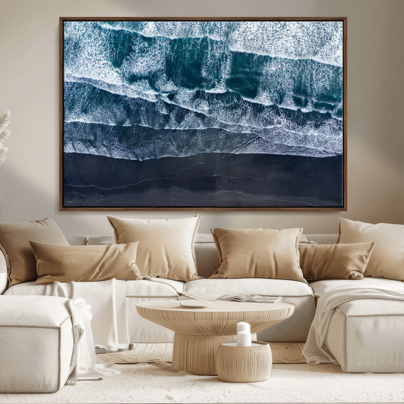 Canvas of aerial ocean waves crashing onto a black sand beach in moody tones, ideal for modern coastal or minimalist home decor.