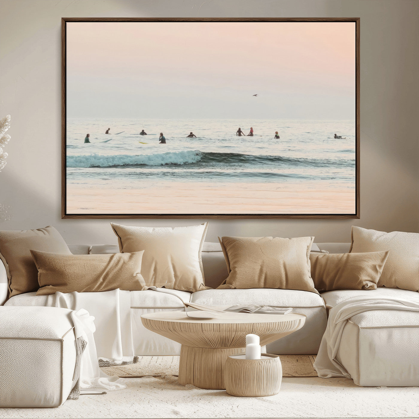 Dreamy photo of surfers waiting on soft pastel waves under a pink sunset sky, ideal for soft coastal minimalist or serene ocean-themed home decor.