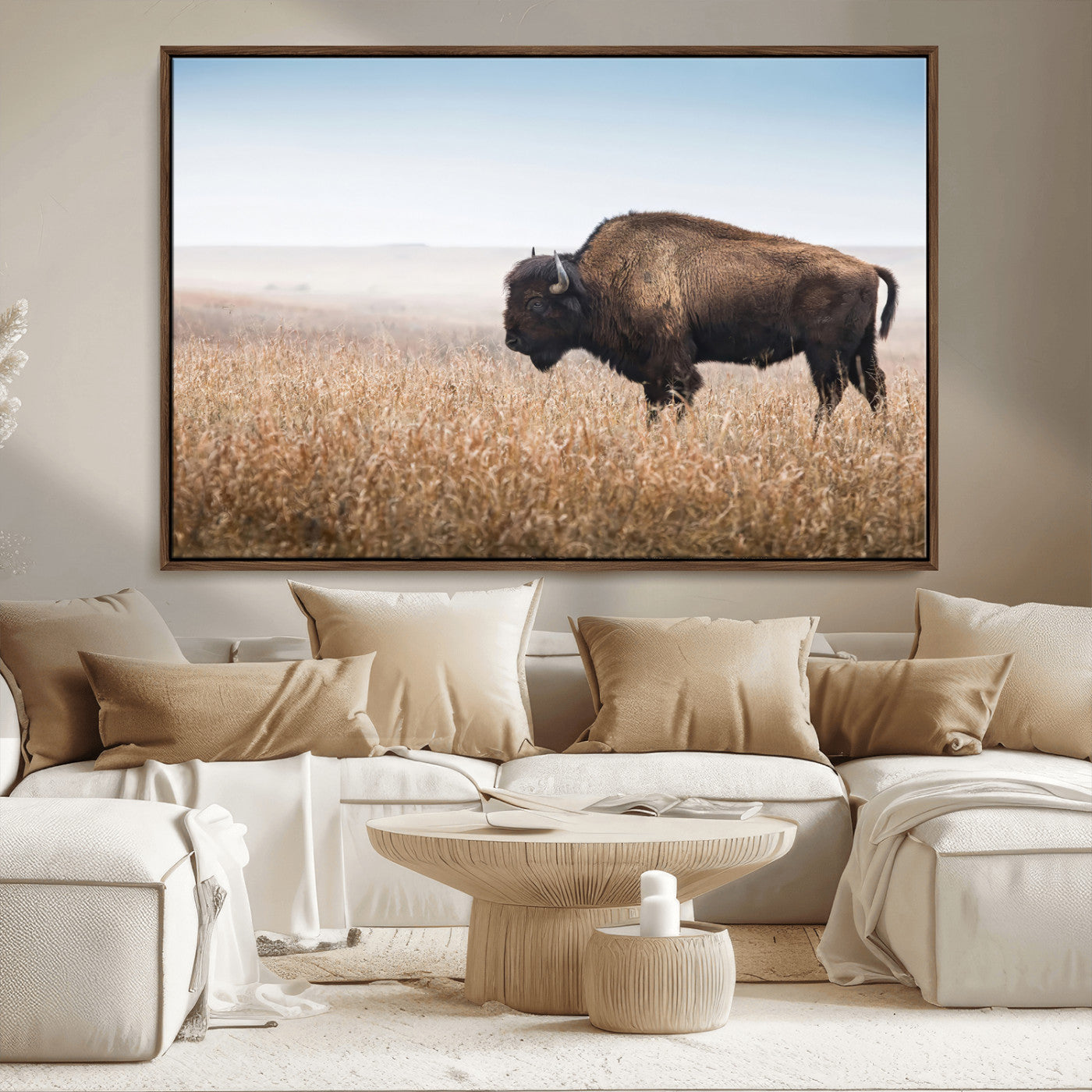 A majestic bison standing in an open prairie field, its strong form blending into the golden grass under a vast blue sky, evoking the wild spirit of the American plains.