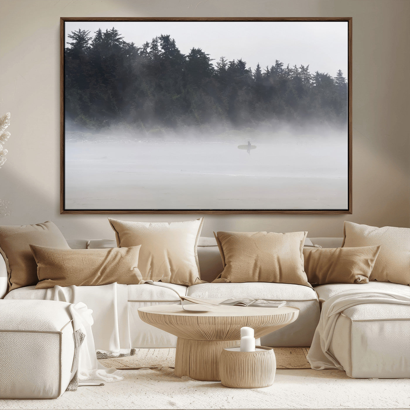 A lone surfer carrying a board through a misty shoreline, surrounded by dense trees and fog, creating a peaceful and mysterious coastal scene.