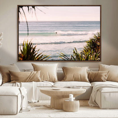 Canvas of a lone surfer riding a pastel wave at sunrise, perfect for tropical or coastal-themed spaces with a relaxed, airy vibe.