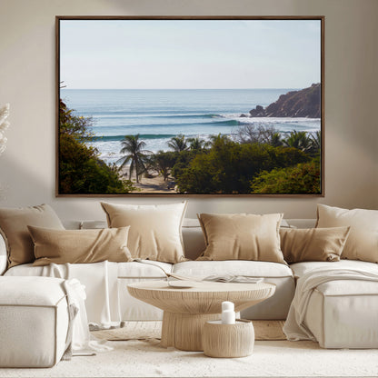View of calm ocean waves with palm trees and a tropical coastline, ideal for coastal boho or beach-themed wall decor.