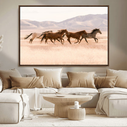A herd of wild horses galloping through a sunlit desert plain with mountains in the background, perfect for rustic or western-themed wall decor.