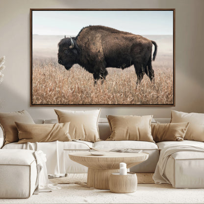 A lone bison stands in a vast prairie under a soft sky, evoking freedom and rustic charm for western or farmhouse inspired interiors.