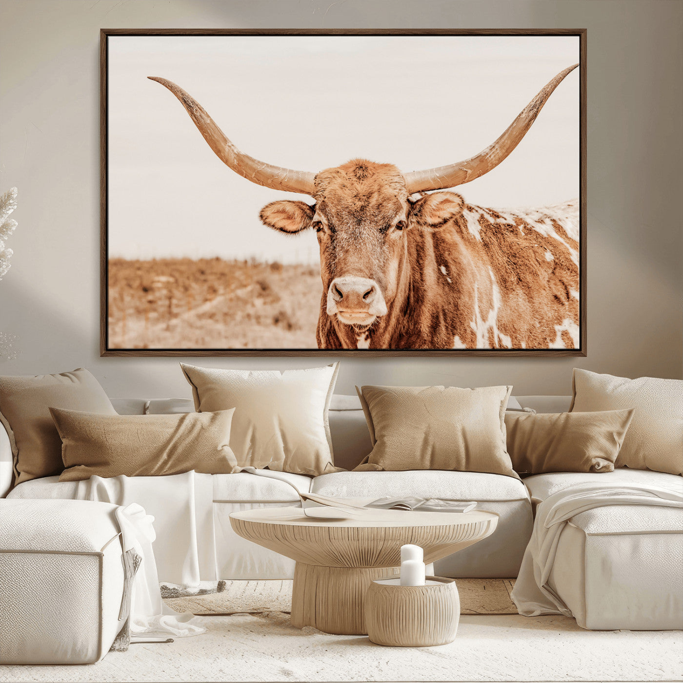 A longhorn bull standing proudly in a sunlit desert field with warm neutral tones, ideal for rustic western or farmhouse interiors.