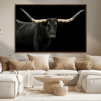 Close-up of a black Texas longhorn with large curved horns on black background, ideal for rustic farmhouse or modern western interiors.