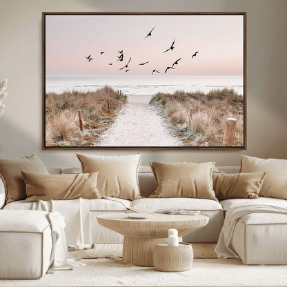 A peaceful coastal pathway leading to the ocean, with birds flying across a soft pastel sky, creating a calm and scenic beach atmosphere.