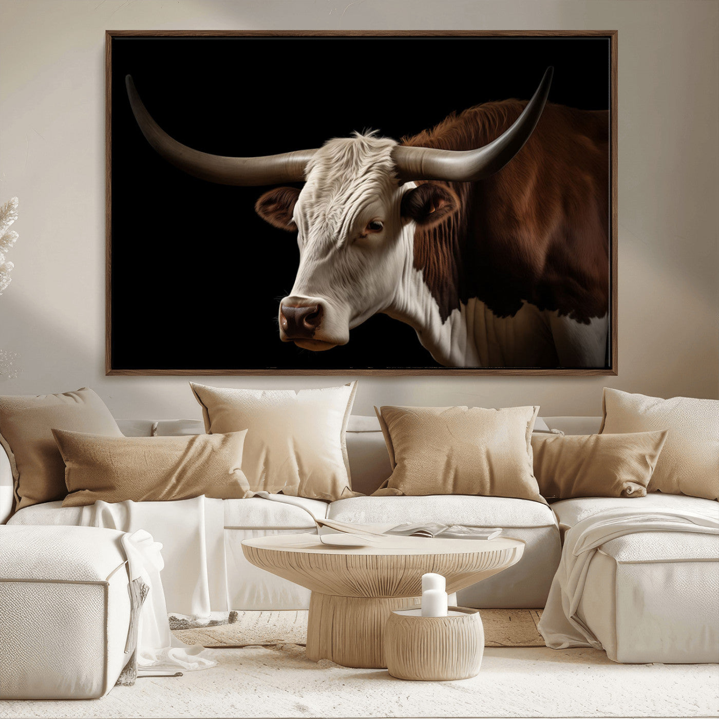 "Close-up of a brown and white longhorn cow with prominent curved horns against a black background."