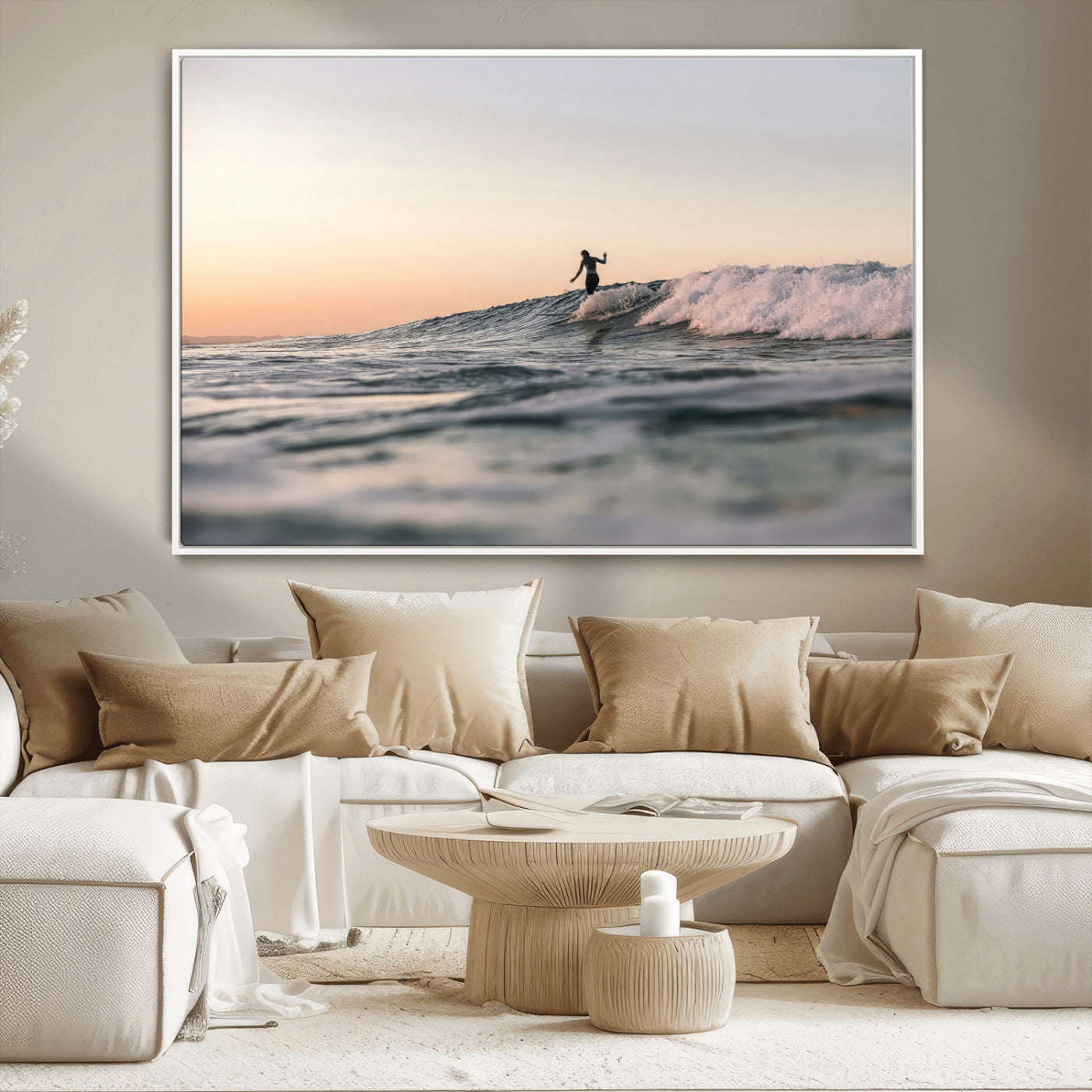 Framed canvas of a female surfer balancing on a wave at sunset, perfect for serene surf or ocean-inspired coastal decor.