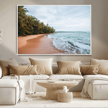 Framed canvas of a tropical beach with palm trees and soft waves, ideal for coastal escape or serene nature-inspired home decor.