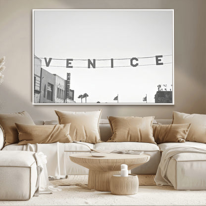 Black and white photo of Venice Beach sign and palm-lined street, perfect for urban coastal or minimalist LA-inspired wall decoration.