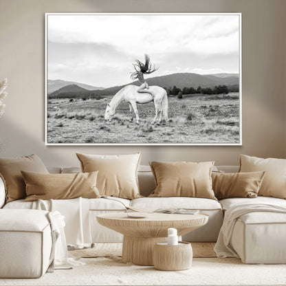 Black and white photo of a woman on a white horse in moody tones, ideal for Western Boho or modern rustic-style home decor.