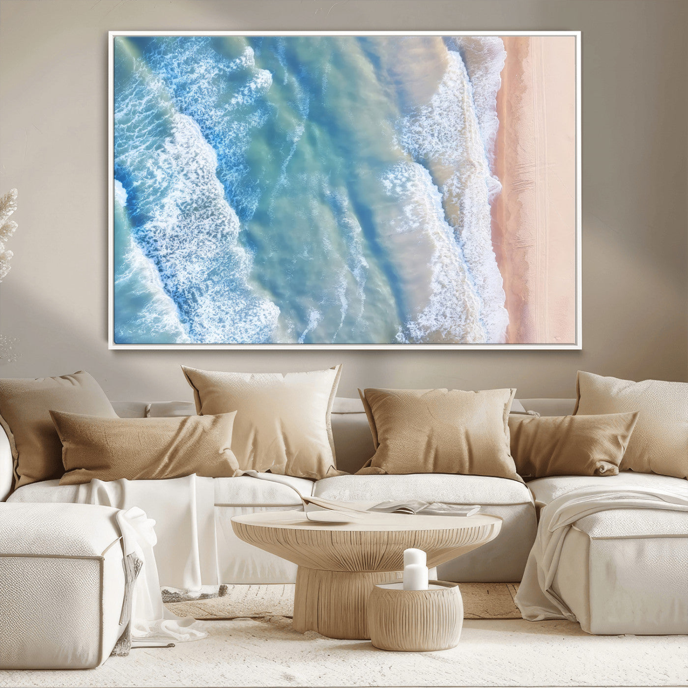 Aerial photo of soft blue waves meeting sandy shore, perfect for modern coastal or beach-themed decor with a light and tranquil aesthetic.