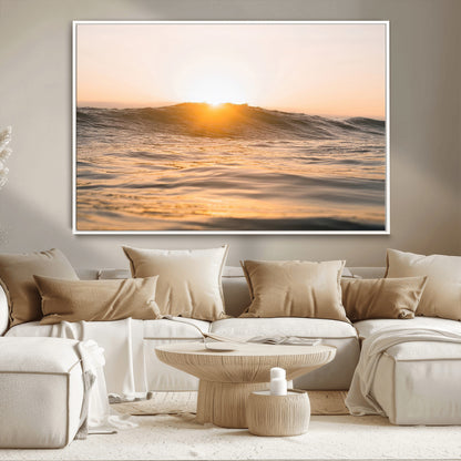 Ocean waves glowing under a warm golden sunset, reflecting soft light and calm movement, perfect for warm minimalist coastal interiors.