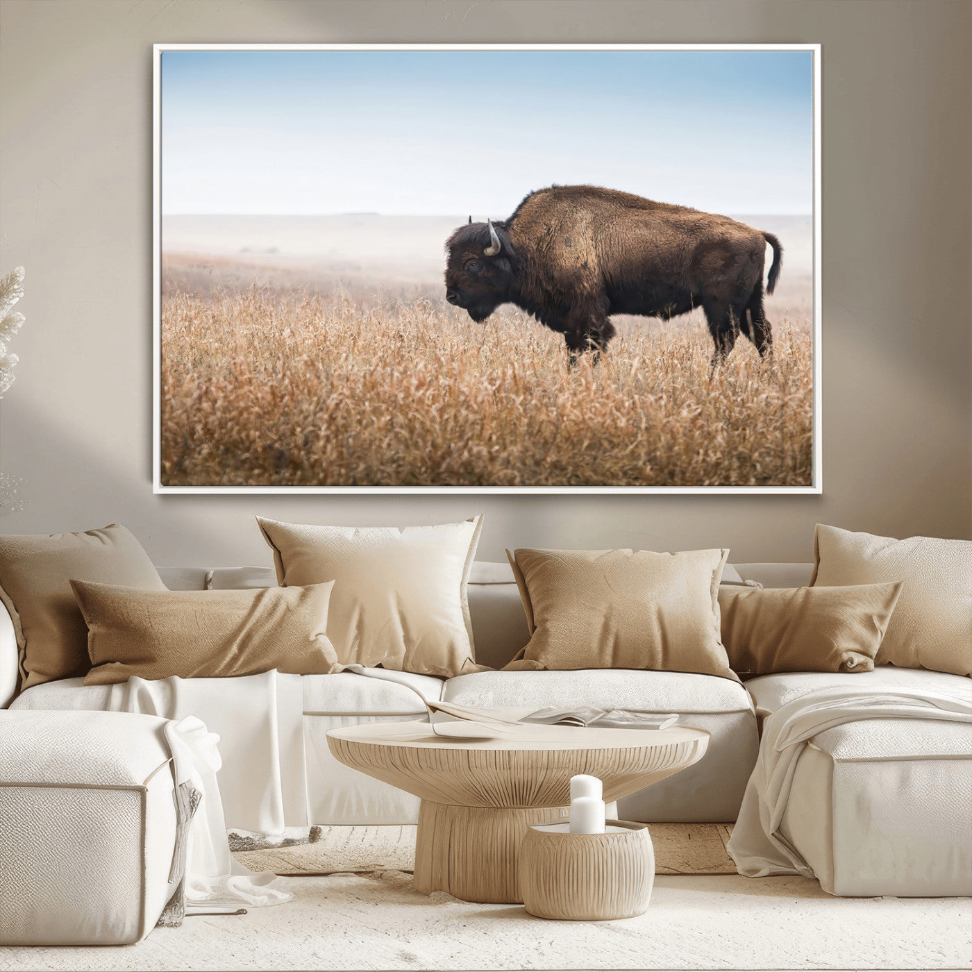 A majestic bison standing in an open prairie field, its strong form blending into the golden grass under a vast blue sky, evoking the wild spirit of the American plains.