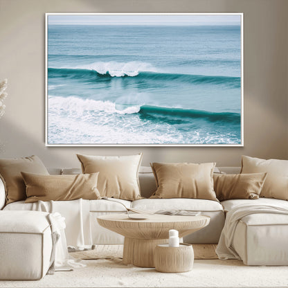 Powerful ocean waves rolling towards the shore, their turquoise hues blending with white sea foam under an open horizon, capturing the essence of the ocean's movement.