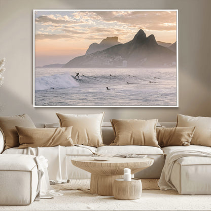 A surfer rides a golden hour wave near misty coastal mountains, surrounded by fellow surfers, capturing the spirit of a coastal adventure.