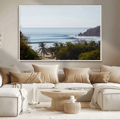 View of calm ocean waves with palm trees and a tropical coastline, ideal for coastal boho or beach-themed wall decor.
