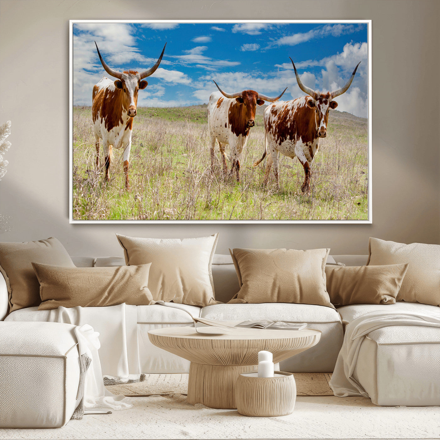 Three Texas longhorn cattle standing in dry grass under a bright blue sky, ideal for farmhouse or western rustic home decor.