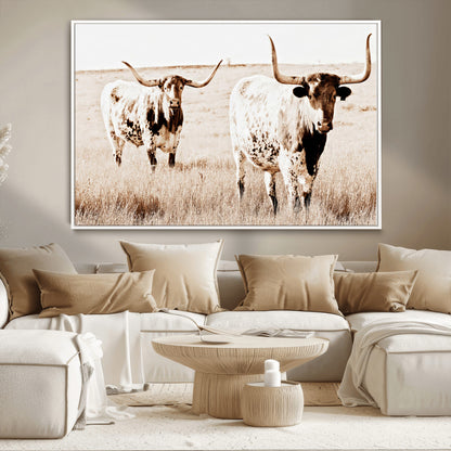 Two Texas longhorn cows standing in a sepia-toned pasture, evoking rustic charm perfect for farmhouse or western country interiors. (