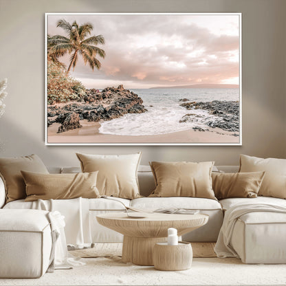 A peaceful beach scene with a palm tree and rocks, soft waves washing onto the shore under a soft pastel sky at sunset.