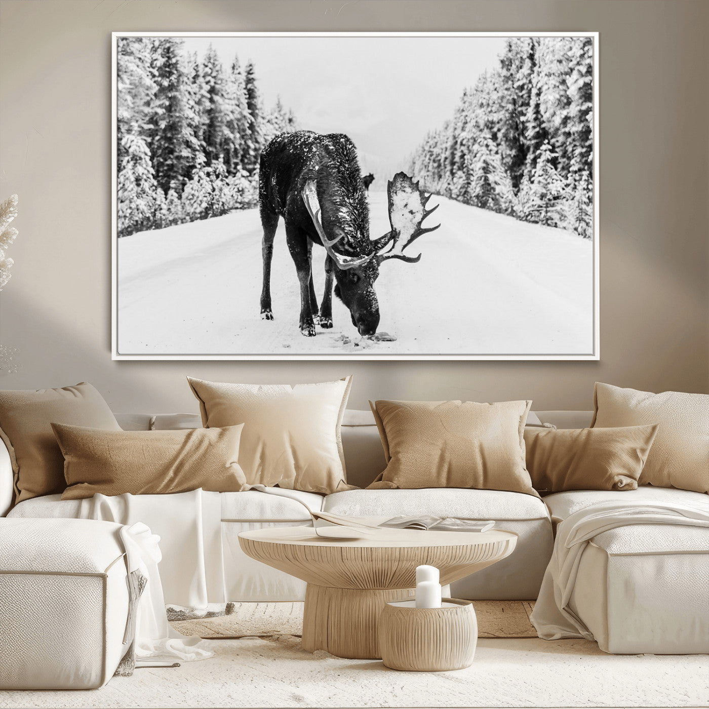 A majestic moose grazing in the snow-covered wilderness, surrounded by snow-covered trees, creating a peaceful winter scene.