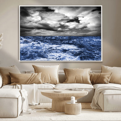 Moody canvas wall art of a stormy ocean under a dramatic black-and-white sky, perfect for bold or coastal-style interiors.