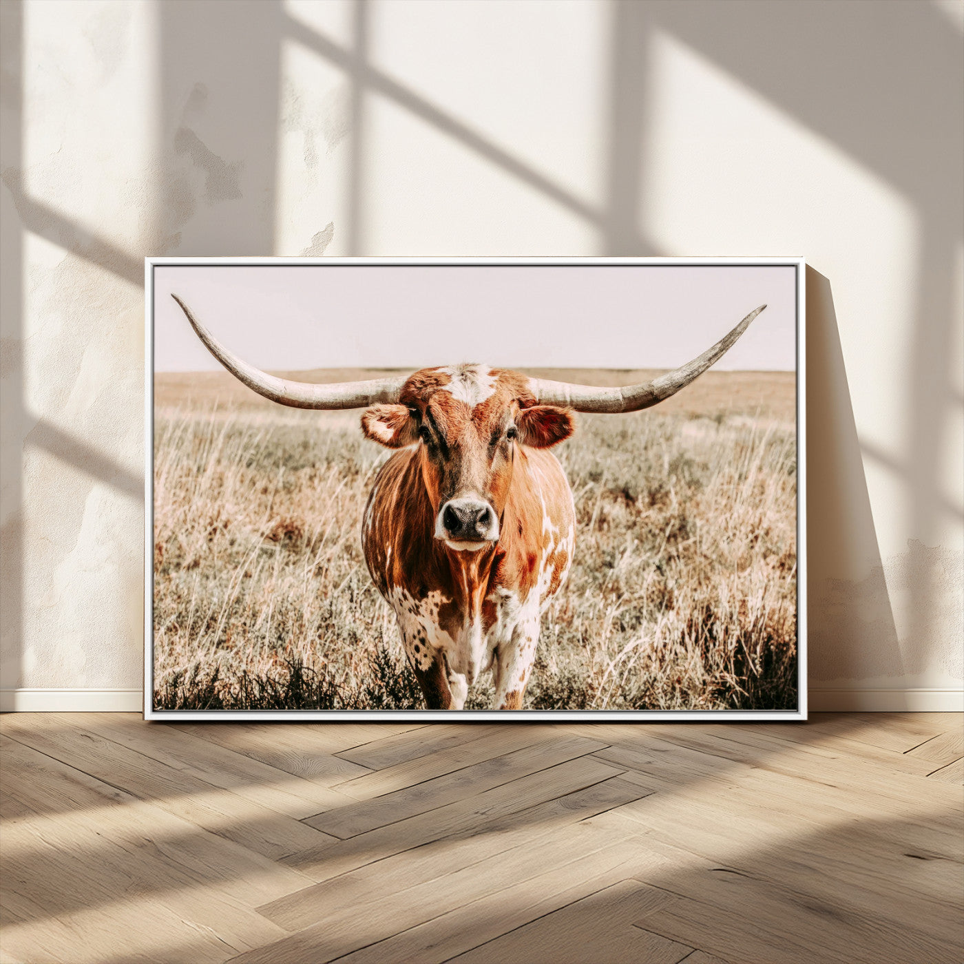 Framed longhorn cow canvas wall art with rustic prairie background, western animal print perfect for farmhouse or ranch style decor