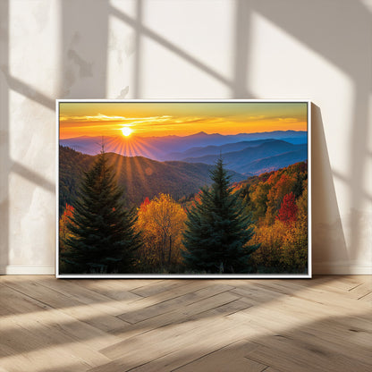 Vibrant sunset over autumn mountains with colorful trees and warm light, ideal for nature lovers or cabin-style wall decor.