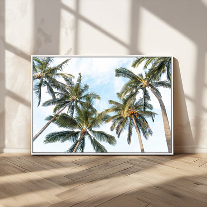 Framed canvas of tall palm trees reaching into a tropical sky, ideal for beach home or relaxed island-inspired wall decor.