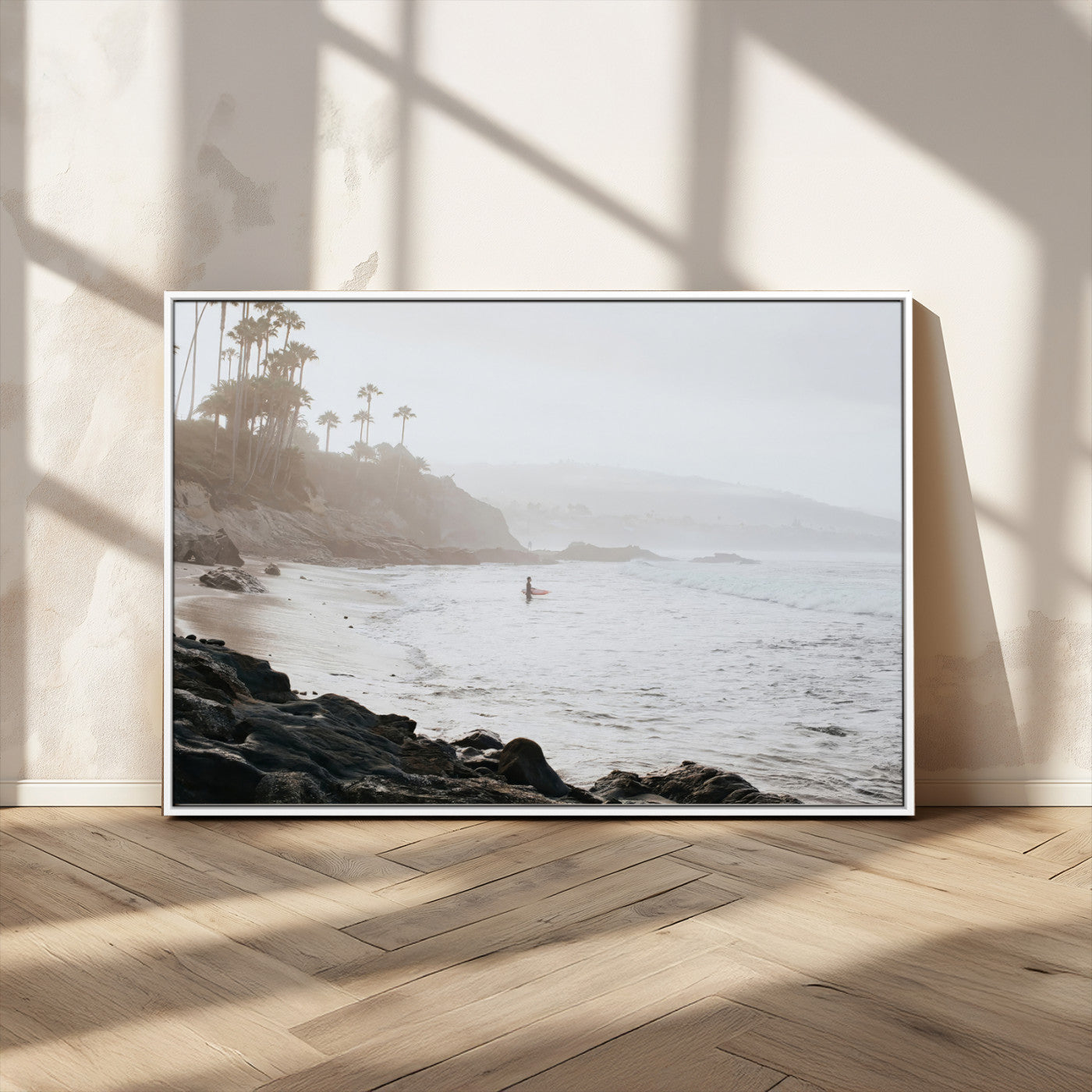Framed canvas of a surfer in misty coastal tones at a foggy California beach, ideal for minimalist coastal beach or serene ocean-themed decor.