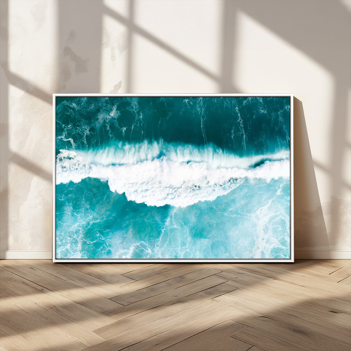 Aerial view of turquoise ocean waves crashing with white foam, perfect for tropical coastal or modern beach-style home decor.