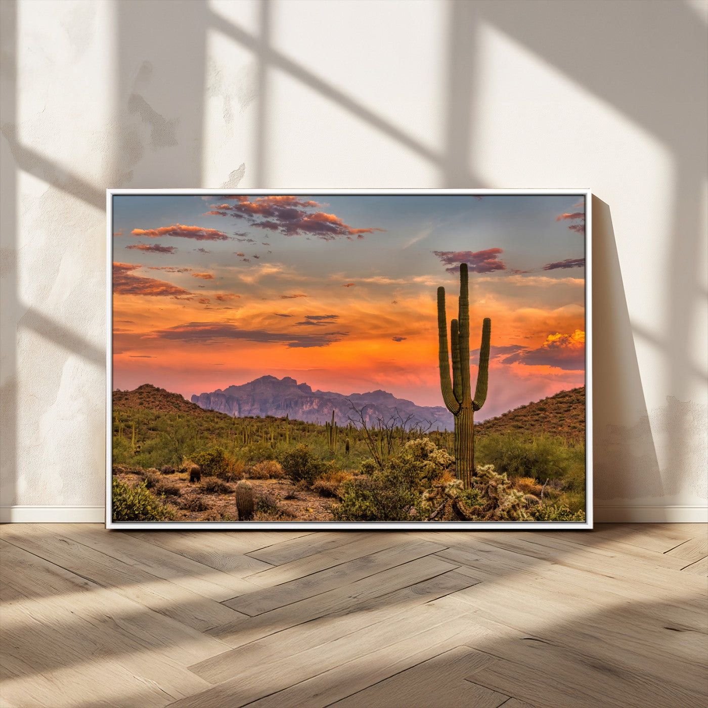 Vibrant desert sunset with saguaro cacti and distant mountains, perfect for Southwestern or warm-toned home decor.
