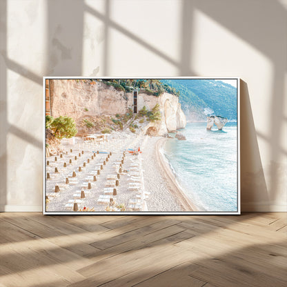 Wall art of a calm Mediterranean beach with rows of sun loungers and umbrellas in soft pastel tones, perfect for light coastal or vacation-themed decor.