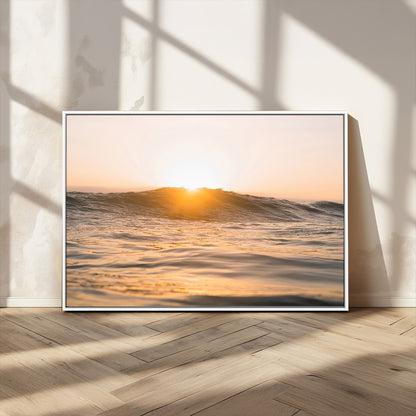 Ocean waves glowing under a warm golden sunset, reflecting soft light and calm movement, perfect for warm minimalist coastal interiors.