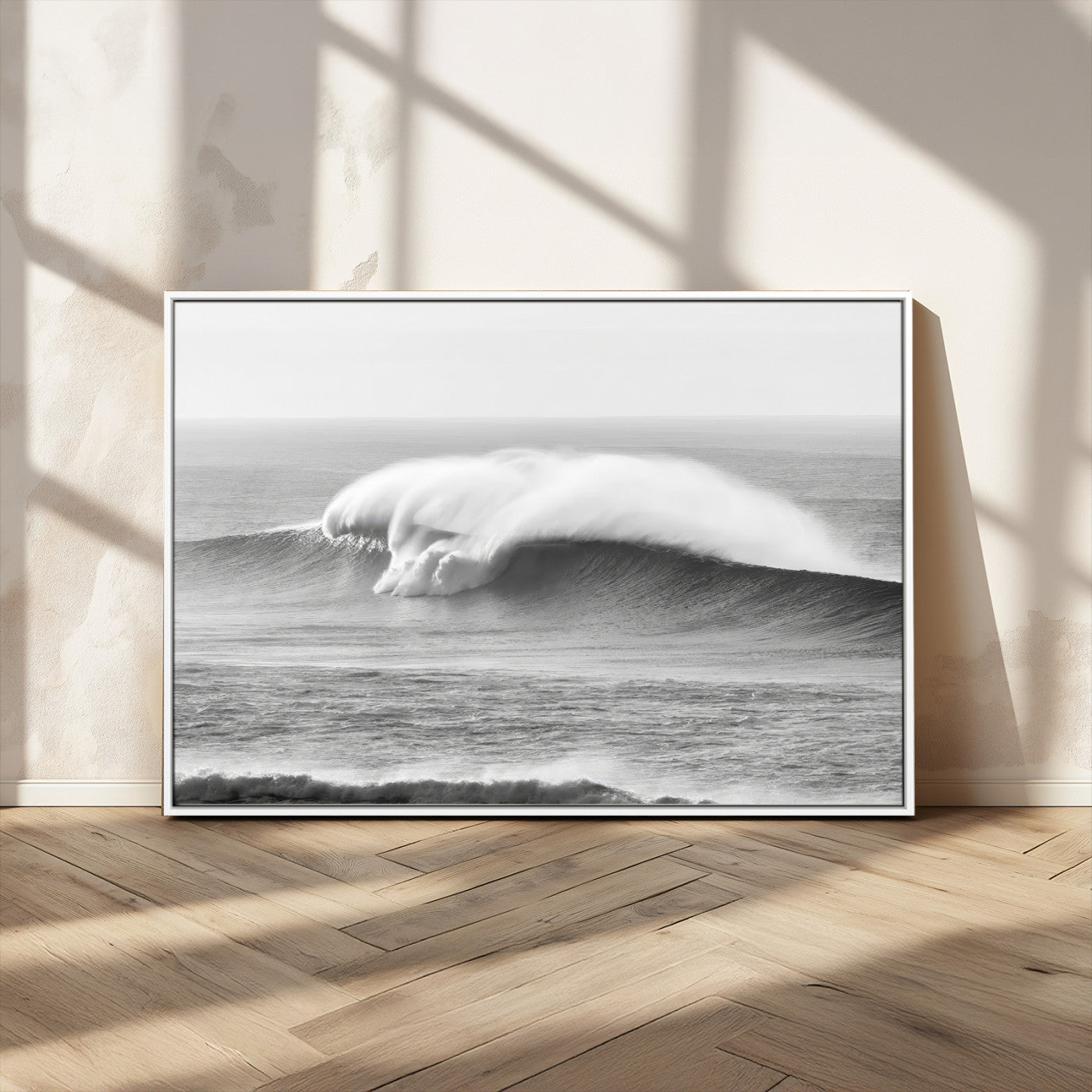 A dramatic black and white ocean wave crashing with immense force, capturing the raw power and movement of the sea in a bold seascape.