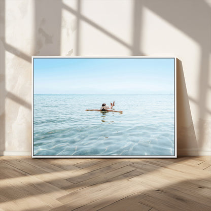 A peaceful minimalist scene of a person floating on crystal-clear water, surrounded by a vast open horizon, capturing relaxation and serenity in a tranquil aquatic setting.