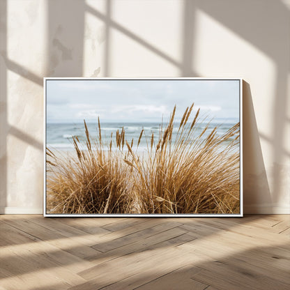 Canvas of golden beach grass swaying by the ocean under a soft cloudy sky, perfect for neutral-toned or coastal minimalist decor.