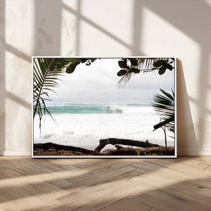 Tropical beach view with palm trees and surfer riding a wave, perfect for boho or coastal-inspired interior wall decor.