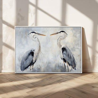 Two herons facing each other on a soft-toned background with blue-grey feathers, perfect for tranquil, coastal or nature-themed interiors.