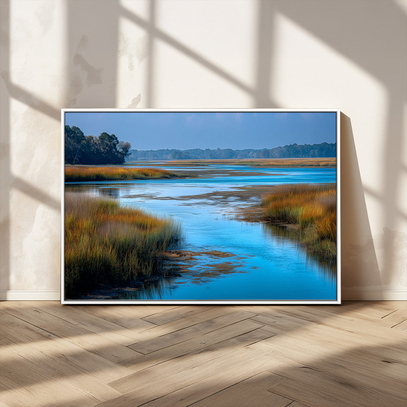 A peaceful marshland scene with calm blue water reflecting the surrounding grasses and trees, capturing the beauty of nature in a serene landscape.