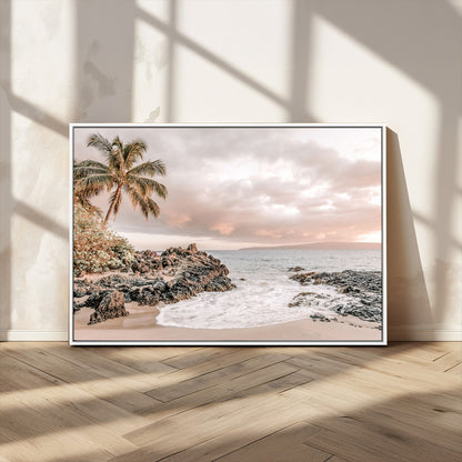 A peaceful beach scene with a palm tree and rocks, soft waves washing onto the shore under a soft pastel sky at sunset.