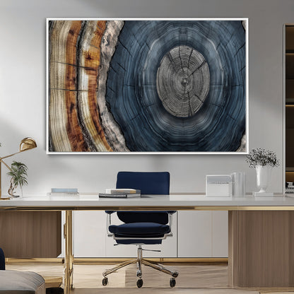 A stunning close-up of a tree trunk showing the intricate, circular growth rings, showcasing the natural textures and rich contrasts in deep blues, browns, and silvers.