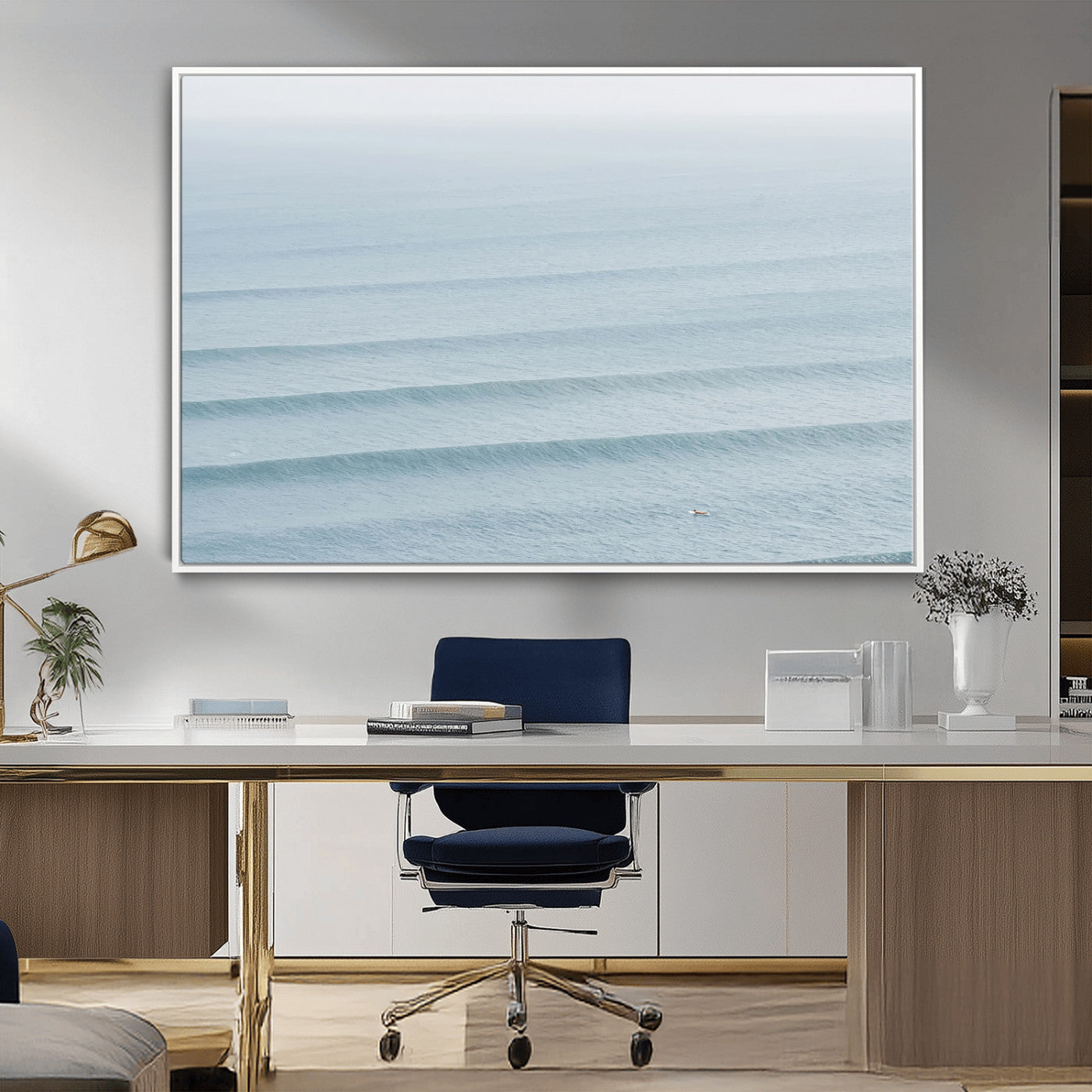 Framed canvas of repeating ocean waves with a distant solo surfer, ideal for minimalist ocean or calm coastal wall decor.