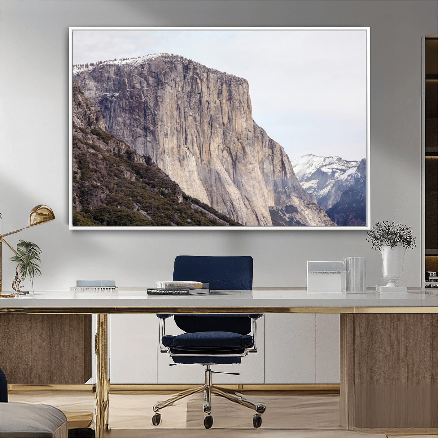 Framed canvas of El Capitan’s vertical granite face in Yosemite with snowy peaks, ideal for Sierra minimalism or mountain-inspired decor.