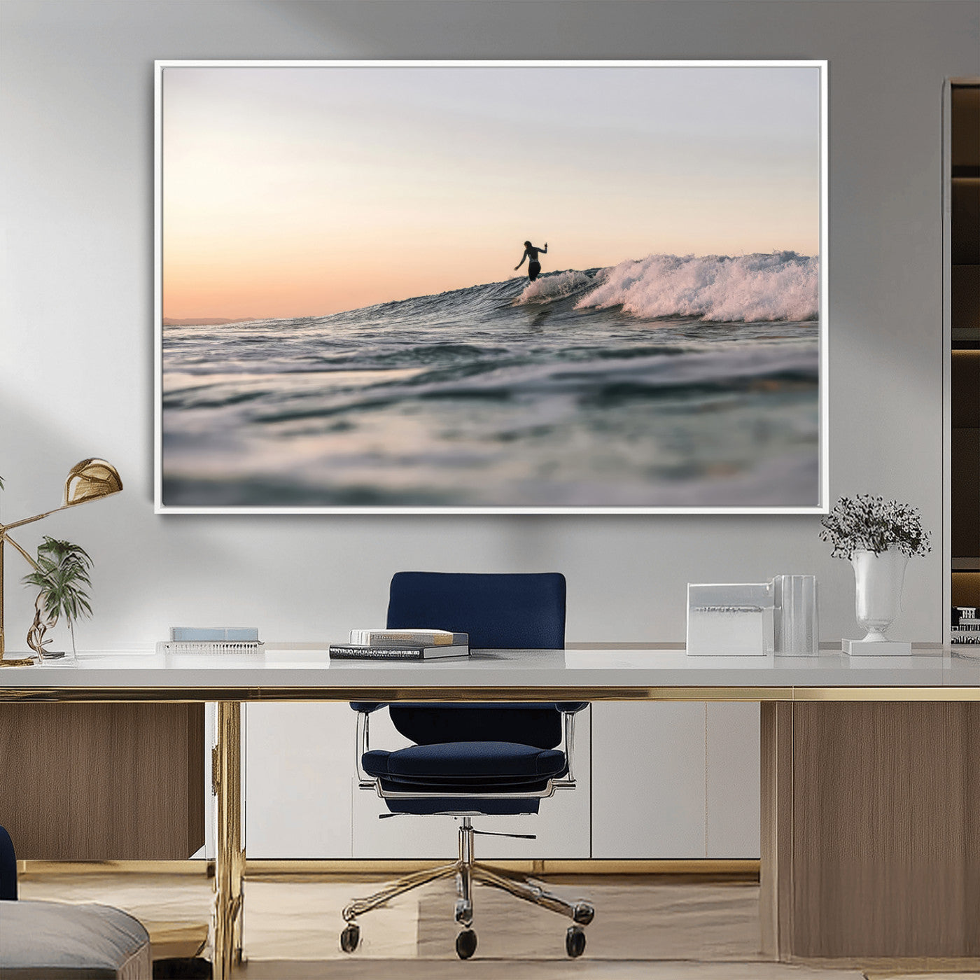 Framed canvas of a female surfer balancing on a wave at sunset, perfect for serene surf or ocean-inspired coastal decor.