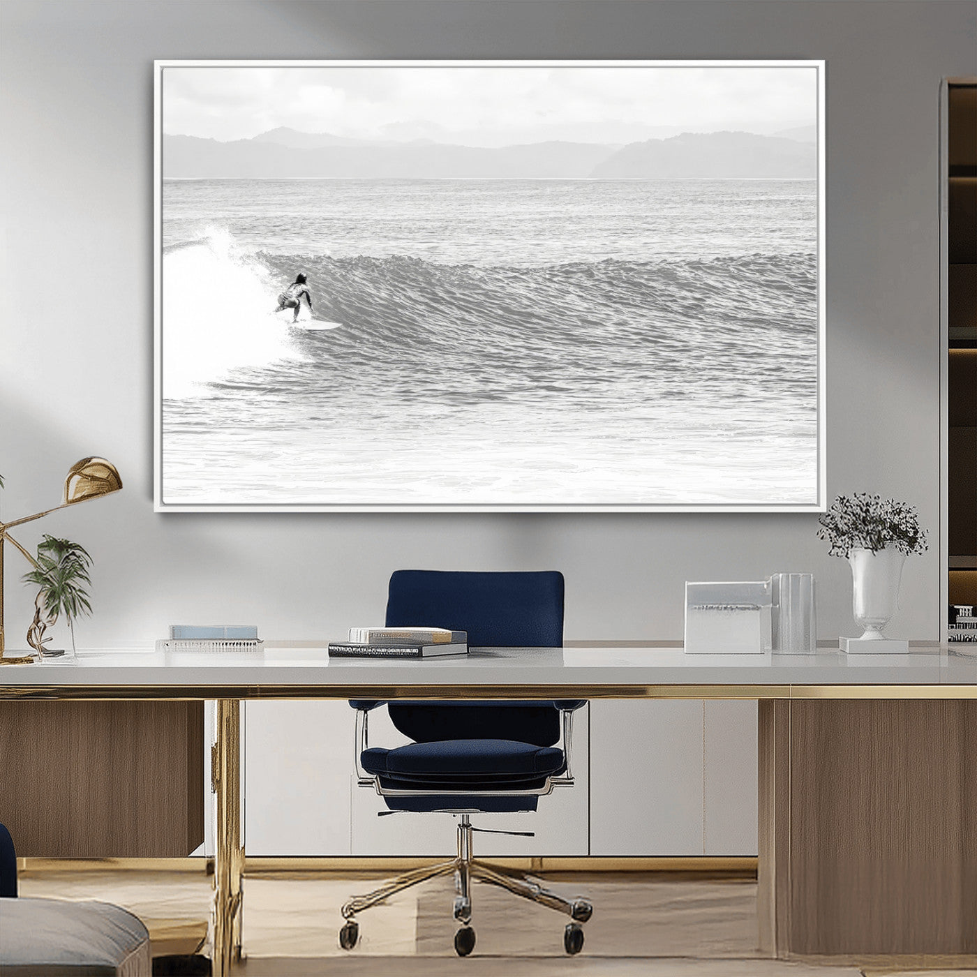 Monochrome photo of a surfer riding a wave with distant mountains, ideal for coastal motion or black and white surf-themed wall decor.