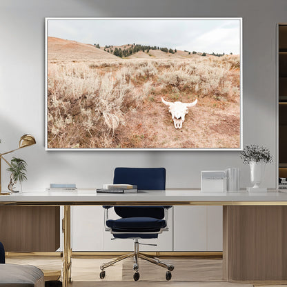 Rustic bull skull on dry sagebrush field under soft light, ideal for western minimal or desert prairie-style wall decoration.